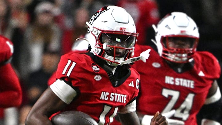 Nov 1, 2025; Raleigh, North Carolina, USA;  North Carolina State Wolfpack quarterback CJ Bailey (11) runs the ball during the first quarter against the Georgia Tech Yellow Jackets at Carter-Finley Stadium. Mandatory Credit: Zachary Taft-Imagn Images