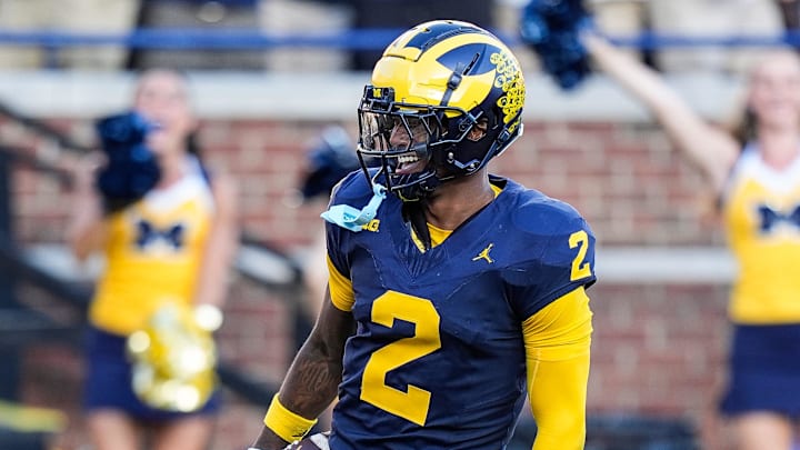 Michigan defensive back Will Johnson (2) celebrates a touchdown after intercepting USC quarterback Miller Moss (7) during the second half at Michigan Stadium in Ann Arbor on Saturday, Sept. 21, 2024.