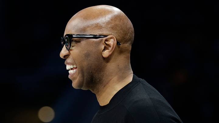 Mar 29, 2026; Charlotte, North Carolina, USA; Boston Celtics assistant coach Sam Cassell (right) watches from the sideline during the second half against the Charlotte Hornets at Spectrum Center. Mandatory Credit: Brian Westerholt-Imagn Images