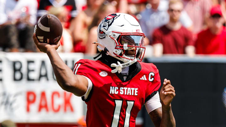 Sep 6, 2025; Raleigh, North Carolina, USA; North Carolina State Wolfpack quarterback CJ Bailey (11) throws the football during the first half of the game against Virginia Cavaliers at Carter-Finley Stadium. Mandatory Credit: Jaylynn Nash-Imagn Images Sep 6, 2025; Raleigh, North Carolina, USA; North Carolina State Wolfpack quarterback CJ Bailey (11) throws the football during the first half of the game against Virginia Cavaliers at Carter-Finley Stadium. Mandatory Credit: Jaylynn Nash-Imagn Images