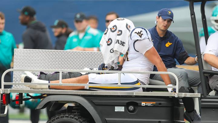 Sep 5, 2026; Morgantown, West Virginia, USA; West Virginia Mountaineers defensive lineman Darius Wiley (91) is carted off the field during the fourth quarter after an injury against the Coastal Carolina Chanticleers at Milan Puskar Stadium. Mandatory Credit: Ben Queen-Imagn Images Sep 5, 2026; Morgantown, West Virginia, USA; West Virginia Mountaineers defensive lineman Darius Wiley (91) is carted off the field during the fourth quarter after an injury against the Coastal Carolina Chanticleers at Milan Puskar Stadium. Mandatory Credit: Ben Queen-Imagn Images