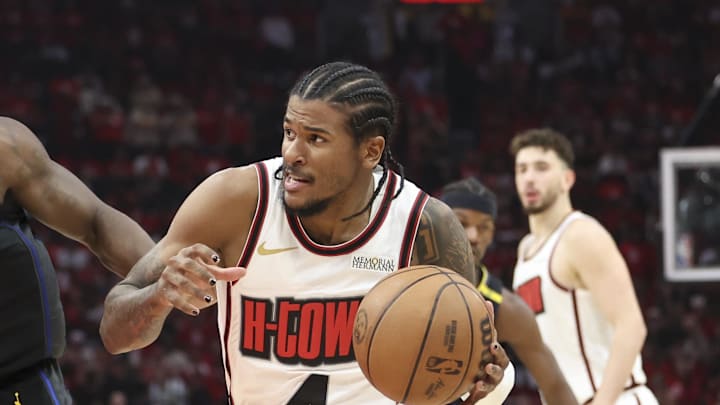 May 4, 2025; Houston, Texas, USA; Houston Rockets guard Jalen Green (4) drives with the ball as Golden State Warriors forward Draymond Green (23) defends during game seven of the first round for the 2025 NBA Playoffs at Toyota Center. Mandatory Credit: Troy Taormina-Imagn Images