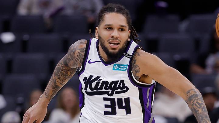 Oct 13, 2026; Sacramento, California, USA; Sacramento Kings guard Emanuel Sharp (34) and Portland Trail Blazers guard Jayson Kent (29) chase down the ball during the fourth quarter at Golden 1 Center. Mandatory Credit: Kelley L Cox-Imagn Images