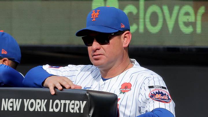 May 25, 2026; New York City, New York, USA; New York Mets manager Carlos Mendoza (64) watches from the dugout during the third inning against the Cincinnati Reds at Citi Field. Mandatory Credit: Brad Penner-Imagn Images
