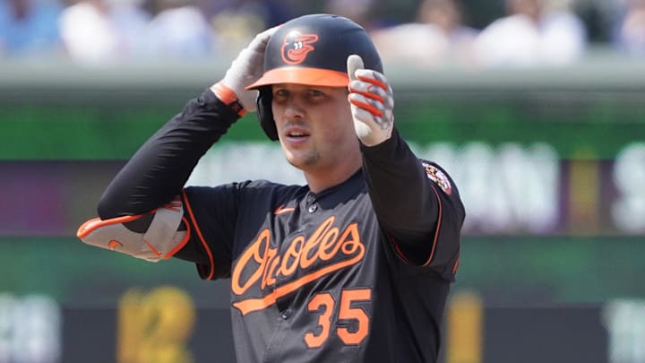 Aug 1, 2025; Chicago, Illinois, USA; Baltimore Orioles catcher Adley Rutschman (35) gestures after hitting a double against the Chicago Cubs during the ninth inning at Wrigley Field. Mandatory Credit: David Banks-Imagn Images Aug 1, 2025; Chicago, Illinois, USA; Baltimore Orioles catcher Adley Rutschman (35) gestures after hitting a double against the Chicago Cubs during the ninth inning at Wrigley Field. Mandatory Credit: David Banks-Imagn Images