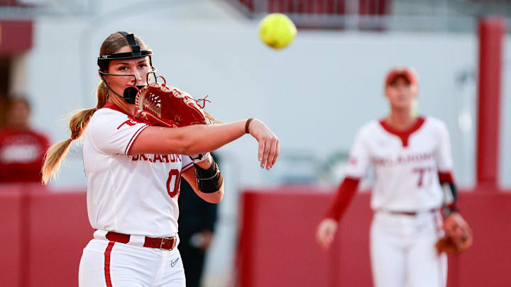 Allyssa Parker fields her position at pitcher and throws over to first to log an out for Oklahoma.