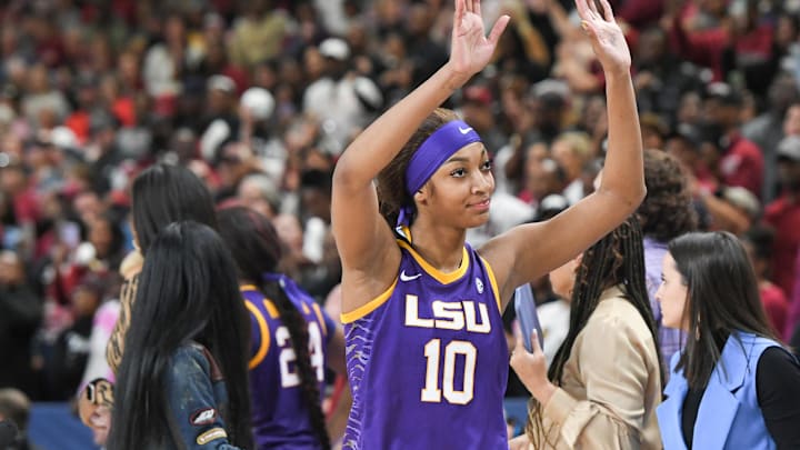 Louisiana State University forward Angel Reese (10) waves to fans. Louisiana State University forward Angel Reese (10) waves to fans.