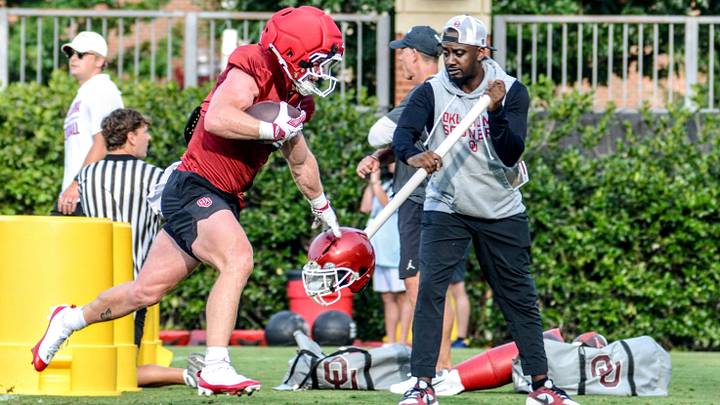 Oklahoma running back Andy Bass rushes during practice. Bass has returned from a pair of ACL injuries to work his way back into the mix at running back. Oklahoma running back Andy Bass rushes during practice. Bass has returned from a pair of ACL injuries to work his way back into the mix at running back.