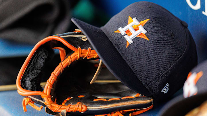 Apr 27, 2025; Kansas City, Missouri, USA; Houston Astros hat and glove in the dugout during the second inning against the Kansas City Royals at Kauffman Stadium. Apr 27, 2025; Kansas City, Missouri, USA; Houston Astros hat and glove in the dugout during the second inning against the Kansas City Royals at Kauffman Stadium.