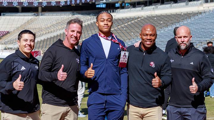 Texas A&M Aggies recruiting target Donald Tabron with the coaching staff