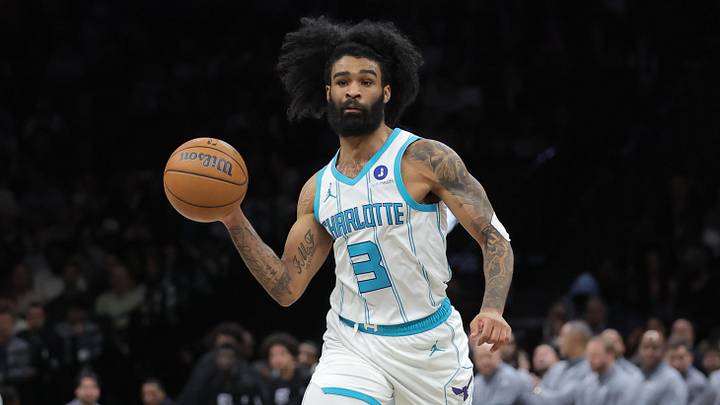 Mar 31, 2026; Brooklyn, New York, USA; Charlotte Hornets guard Coby White (3) passes the ball against Brooklyn Nets guard Tyson Etienne (10) during the fourth quarter at Barclays Center. Mandatory Credit: Brad Penner-Imagn Images