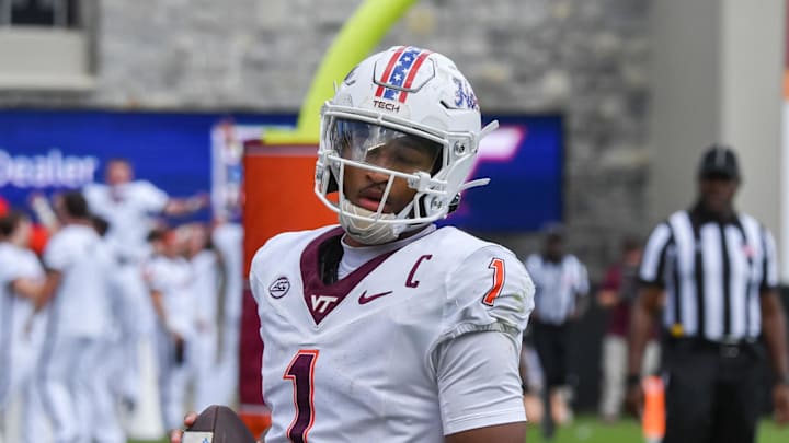 Sep 20, 2025; Blacksburg, Virginia, USA;  Virginia Tech Hokies quarterback Kyron Drones (1) after a touchdown run during the fourth quarter against the the Wofford Terriers at Lane Stadium. Mandatory Credit: Brian Bishop-Imagn Images