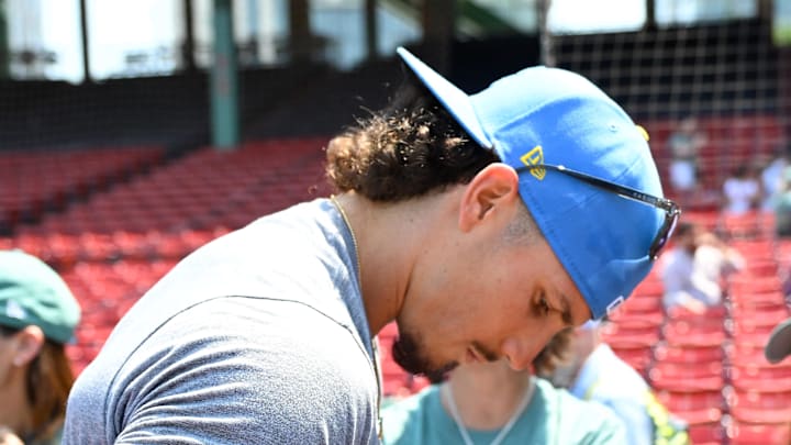 Boston Red Sox center fielder Jarren Duran (16) signs autographs before a game against the Tampa Bay Rays at Fenway Park on July 12. 