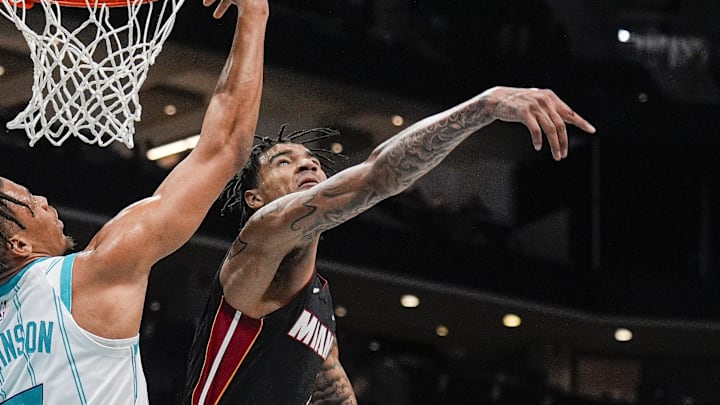 Oct 8, 2024; Charlotte, North Carolina, USA; Miami Heat center Kel'el Ware (7) blocks a shot by Charlotte Hornets forward Keyontae Johnson (7) during the second half at Spectrum Center. Mandatory Credit: Jim Dedmon-Imagn Images Oct 8, 2024; Charlotte, North Carolina, USA; Miami Heat center Kel'el Ware (7) blocks a shot by Charlotte Hornets forward Keyontae Johnson (7) during the second half at Spectrum Center. Mandatory Credit: Jim Dedmon-Imagn Images