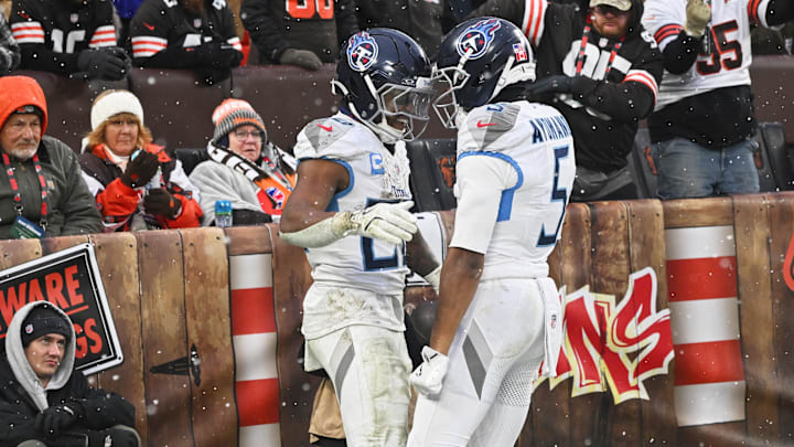 Dec 7, 2025; Cleveland, Ohio, USA; Fans react as Tennessee Titans running back Tony Pollard (20) celebrates with wide receiver Elic Ayomanor (5) after scoring a touchdown against the Cleveland Browns during the third quarter at Huntington Bank Field. Mandatory Credit: Ken Blaze-Imagn Images Dec 7, 2025; Cleveland, Ohio, USA; Fans react as Tennessee Titans running back Tony Pollard (20) celebrates with wide receiver Elic Ayomanor (5) after scoring a touchdown against the Cleveland Browns during the third quarter at Huntington Bank Field. Mandatory Credit: Ken Blaze-Imagn Images