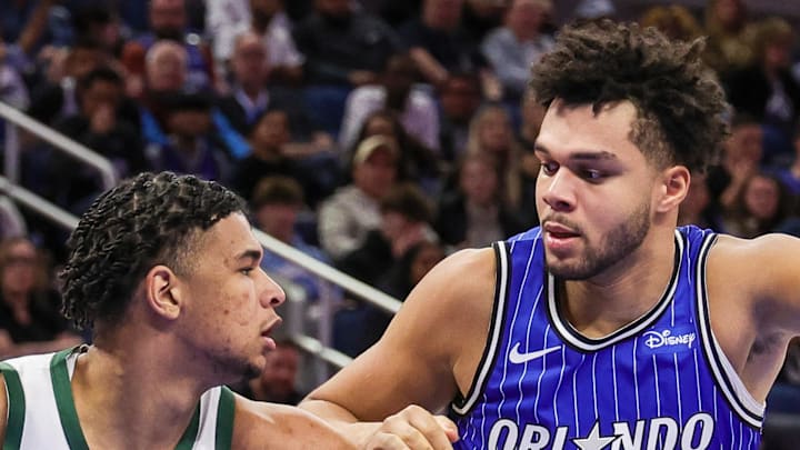 Orlando Magic forward Noah Penda defends Milwaukee Bucks forward Ousmane Dieng.