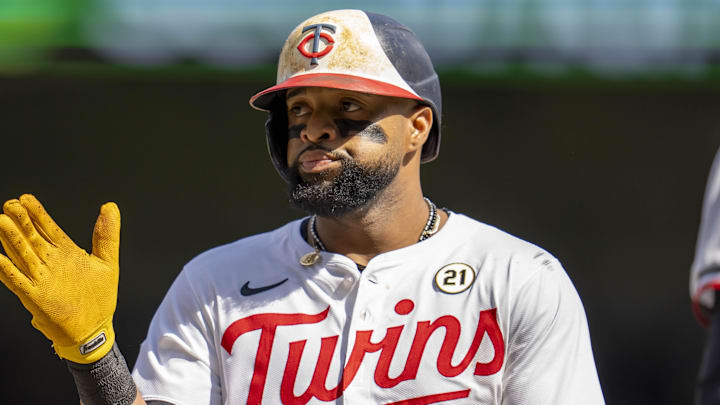 Sep 15, 2024; Minneapolis, Minnesota, USA; Minnesota Twins first baseman Carlos Santana (21) celebrates after hitting a single against the Cincinnati Reds in the fourth inning at Target Field. Mandatory Credit: Jesse Johnson-Imagn Images