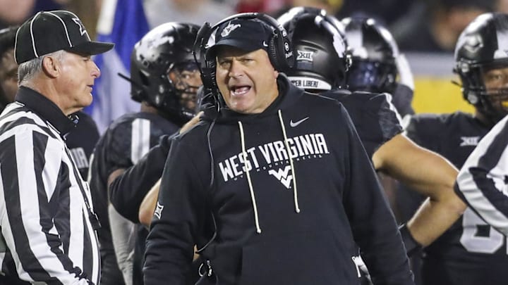 Oct 25, 2025; Morgantown, West Virginia, USA; West Virginia Mountaineers head coach Rich Rodriguez argues a call during the third quarter against the Texas Christian University Horned Frogs at Milan Puskar Stadium. Mandatory Credit: Ben Queen-Imagn Images
