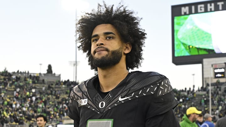 Nov 22, 2025; Eugene, Oregon, USA; Oregon Ducks quarterback Dante Moore (5) walks off the field after the game against the Southern California Trojans at Autzen Stadium. Mandatory Credit: Troy Wayrynen-Imagn Images