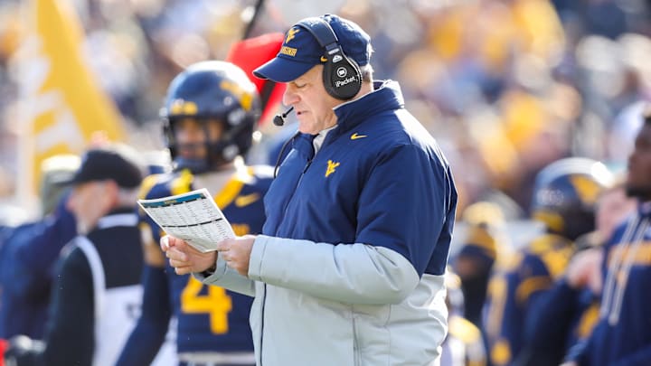 Nov 29, 2025; Morgantown, West Virginia, USA; West Virginia Mountaineers head coach Rich Rodriguez along the sidelines during the first quarter against the Texas Tech Red Raiders at Milan Puskar Stadium. Mandatory Credit: Ben Queen-Imagn Images
