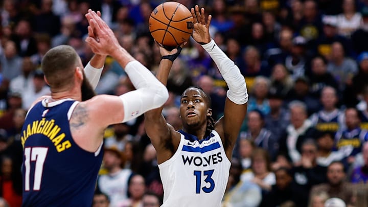 Apr 27, 2026; Denver, Colorado, USA; Minnesota Timberwolves guard Ayo Dosunmu (13) attempts a shot as Denver Nuggets center Jonas Valanciunas (17) defends in the second quarter during game five of the first round of the 2026 NBA Playoffs at Ball Arena. Mandatory Credit: Isaiah J. Downing-Imagn Images