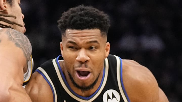 Milwaukee Bucks forward Giannis Antetokounmpo drives for the basket against Denver Nuggets forward Aaron Gordon.