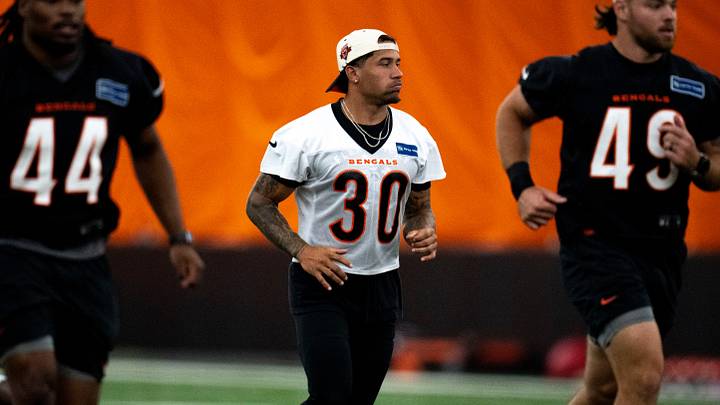 Cincinnati Bengals running back Chase Brown (30) jogs down the field for stretches at Bengals spring practice at the IEL Indoor Facility in Cincinnati on Wednesday, June 12, 2024. Cincinnati Bengals running back Chase Brown (30) jogs down the field for stretches at Bengals spring practice at the IEL Indoor Facility in Cincinnati on Wednesday, June 12, 2024.