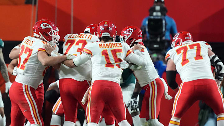 Feb 12, 2023; Glendale, Arizona, US; Kansas City Chiefs quarterback Patrick Mahomes (15) spins with teammates in the huddle during Super Bowl LVII against the Philadelphia Eagles at State Farm Stadium. Mandatory Credit: Joe Camporeale-Imagn Images