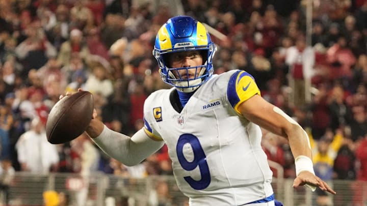 Dec 12, 2024; Santa Clara, California, USA; Los Angeles Rams quarterback Matthew Stafford (9) throws the ball in motion against the San Francisco 49ers during the fourth quarter at Levi's Stadium. Mandatory Credit: Kelley L Cox-Imagn Images