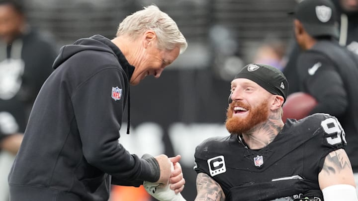 Dec 7, 2025; Paradise, Nevada, USA; Las Vegas Raiders head coach Pete Carroll and defensive end Maxx Crosby (98) interact prior to a game against the Denver Broncos at Allegiant Stadium. Mandatory Credit: Stephen R. Sylvanie-Imagn Images