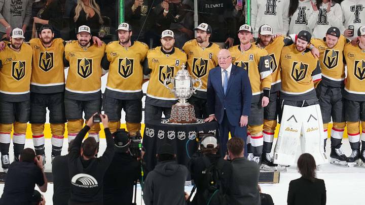 May 26, 2026; Las Vegas, Nevada, USA; Vegas Golden Knights are presented with the Clarence S. Campbell Bowl by Deputy commissioner of the NHL Bill Daly after winning against the Colorado Avalanchein game four of the Western Conference Final of the 2026 Stanley Cup Playoffs at T-Mobile Arena. Mandatory Credit: Stephen R. Sylvanie-Imagn Images