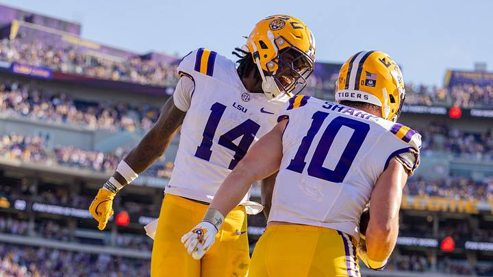 LSU Tigers tight end Trey'Dez Green (14) celebrates a touchdown by tight end Bauer Sharp (10) against the Arkansas Razorbacks during the second half at Tiger Stadium. LSU Tigers tight end Trey'Dez Green (14) celebrates a touchdown by tight end Bauer Sharp (10) against the Arkansas Razorbacks during the second half at Tiger Stadium.