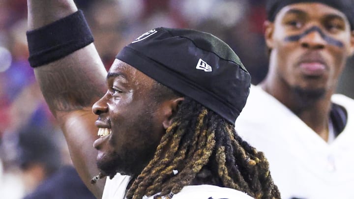 Dec 21, 2025; Houston, Texas, USA; Las Vegas Raiders running back Ashton Jeanty (2) holds a banana on the sideline after catching a touchdown pass against the Houston Texans during the third quarter at NRG Stadium. Mandatory Credit: Troy Taormina-Imagn Images