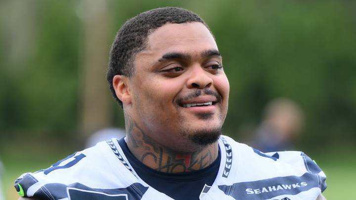 Seattle Seahawks defensive tackle Byron Murphy II (91) smiles