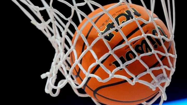 A basketball falls through the net at Legacy Arena during the State Semifinal round.