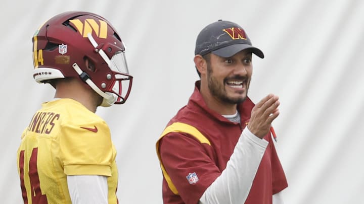 Jun 8, 2023; Ashburn, Virginia, USA; Washington Commanders quarterbacks coach Tavita Pritchard (M) talks to Commanders quarterback Sam Howell (14) and Commanders quarterback Jacoby Brissett (12) during day three of minicamp at OrthoVirginia Training Center at Commanders Park, held inside the training bubble due to poor air quality from Canadian wildfire smoke in Ashburn. Mandatory Credit: Geoff Burke-Imagn Images Jun 8, 2023; Ashburn, Virginia, USA; Washington Commanders quarterbacks coach Tavita Pritchard (M) talks to Commanders quarterback Sam Howell (14) and Commanders quarterback Jacoby Brissett (12) during day three of minicamp at OrthoVirginia Training Center at Commanders Park, held inside the training bubble due to poor air quality from Canadian wildfire smoke in Ashburn. Mandatory Credit: Geoff Burke-Imagn Images