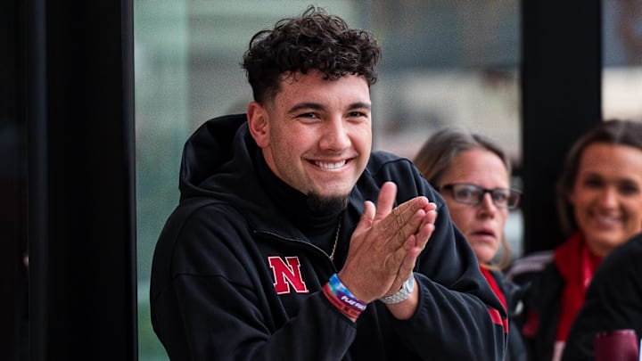 Nov 28, 2025; Lincoln, Nebraska, USA; Nebraska Cornhuskers quarterback Dylan Raiola (15) greets the team as the walk into the stadium before the game against the Iowa Hawkeyes at Memorial Stadium. Mandatory Credit: Dylan Widger-Imagn Images