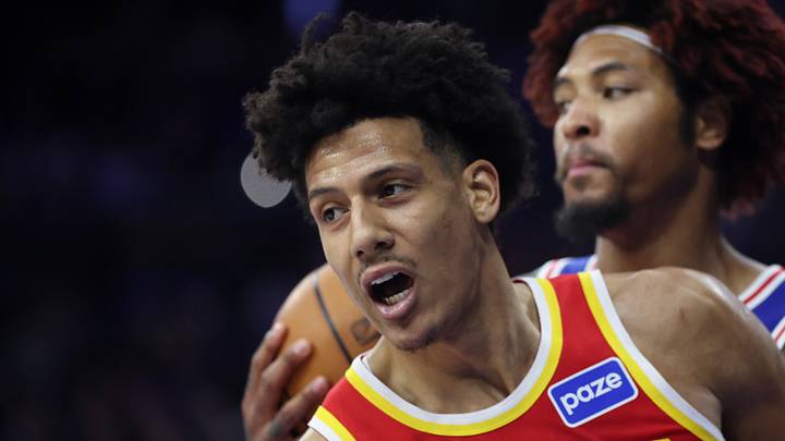 Feb 19, 2026; Philadelphia, Pennsylvania, USA; Atlanta Hawks forward Jalen Johnson (1) reacts to his score in front of Philadelphia 76ers guard Kelly Oubre Jr. (9) during the second quarter at Xfinity Mobile Arena. Mandatory Credit: Bill Streicher-Imagn Images Feb 19, 2026; Philadelphia, Pennsylvania, USA; Atlanta Hawks forward Jalen Johnson (1) reacts to his score in front of Philadelphia 76ers guard Kelly Oubre Jr. (9) during the second quarter at Xfinity Mobile Arena. Mandatory Credit: Bill Streicher-Imagn Images