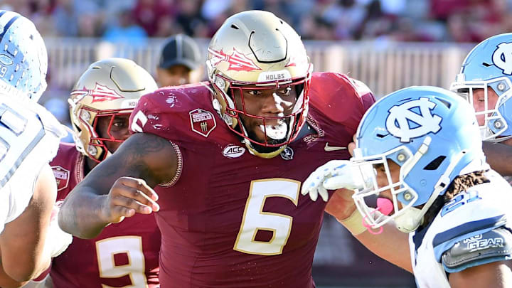 Nov 2, 2024; Tallahassee, Florida, USA; Florida State Seminoles defensive tackle Darrell Jackson Jr (6) pursues North Carolina Tarheels running back Davion Gause (21) in the second quarter at Doak S. Campbell Stadium. Mandatory Credit: Robert Myers-Imagn Images Nov 2, 2024; Tallahassee, Florida, USA; Florida State Seminoles defensive tackle Darrell Jackson Jr (6) pursues North Carolina Tarheels running back Davion Gause (21) in the second quarter at Doak S. Campbell Stadium. Mandatory Credit: Robert Myers-Imagn Images
