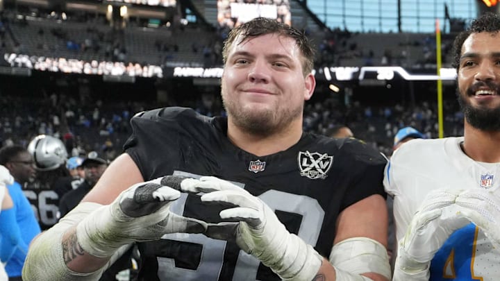 Jan 5, 2025; Paradise, Nevada, USA; Oregon Ducks former players (from left) Las Vegas Raiders guard Jackson Powers-Johnson (58) and Los Angeles Chargers linebacker Troy Dye (43) and quarterback Justin Herbert (10) pose after the game at Allegiant Stadium. Mandatory Credit: Kirby Lee-Imagn Images