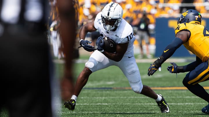 Penn State's Nick Singleton runs with the ball in the first half of an NCAA football game against West Virginia, Saturday, August 31, 2024, in Morgantown, W. Va.