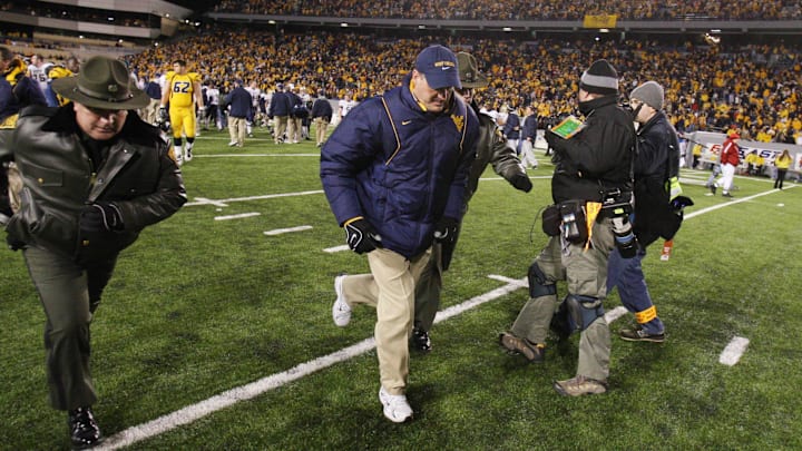 Dec 1, 2007, Morgantown, WV, USA; West Virginia Mountaineer head coach Rich Rodriguez leaves the field after the Mountaineers 13-9 loss to the Pittsburgh Panthers at Mylan Puskar Stadium. Duhart recovered the fumble. Mandatory Credit: Bob Donnan-Imagn Images