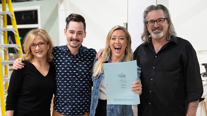 Hallie Todd, Jake Thomas, Hilary Duff, and Robert Carradine on the set of Disney+'s Lizzie McGuire revival