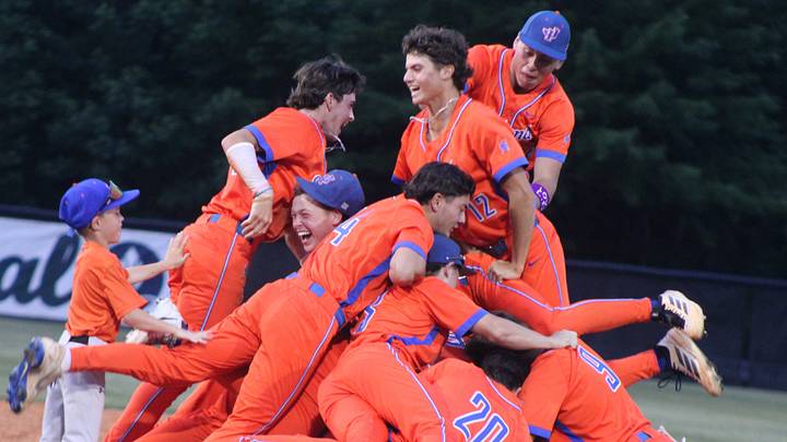 James Island Charter School players pile together on the River Bluff High School mound following the Game Three victory. James Island Charter School players pile together on the River Bluff High School mound following the Game Three victory.