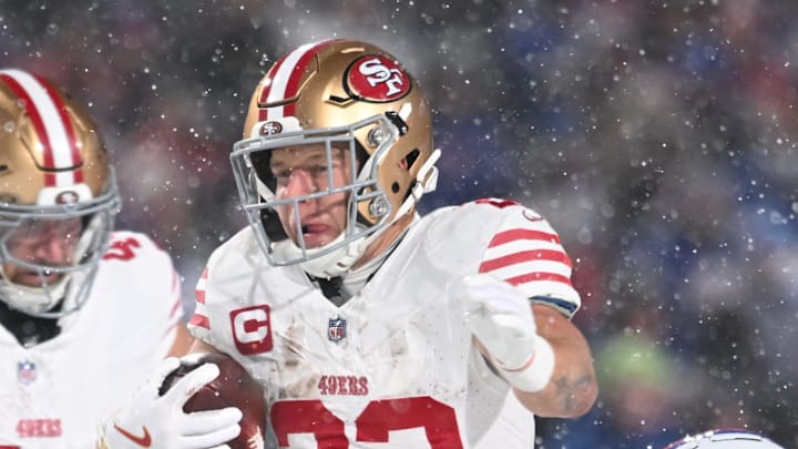 Dec 1, 2024; Orchard Park, New York, USA; San Francisco 49ers running back Christian McCaffrey (23) is tackled by Buffalo Bills safety Taylor Rapp (9) and safety Damar Hamlin (3) in the second quarter at Highmark Stadium. Mandatory Credit: Mark Konezny-Imagn Images