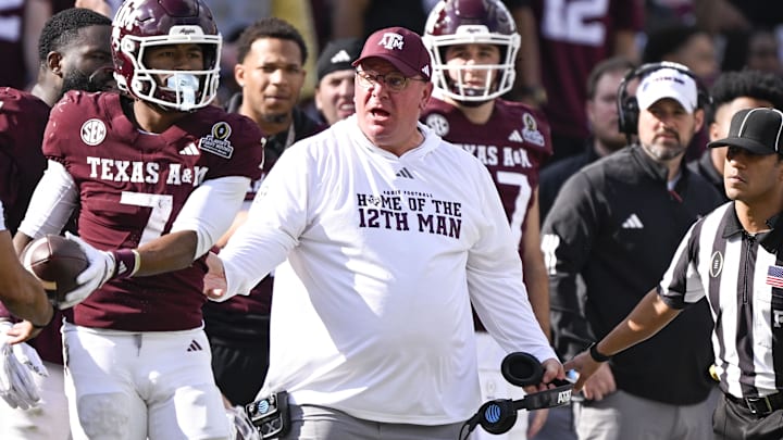 Texas A&M Aggies head coach Mike Elko reacts to a call during the game between the Aggies and the Hurricanes at Kyle Field. 