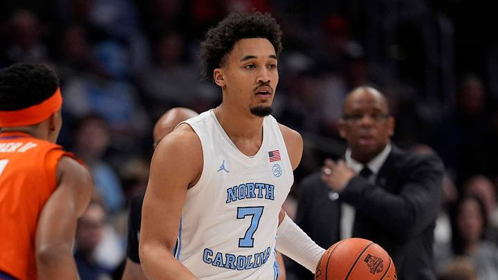 Mar 12, 2026; Charlotte, NC, USA; North Carolina Tar Heels guard Seth Trimble (7) brings the ball up court against Clemson Tigers guard Ace Buckner (21) during the first half at Spectrum Center. Mandatory Credit: Jim Dedmon-Imagn Images