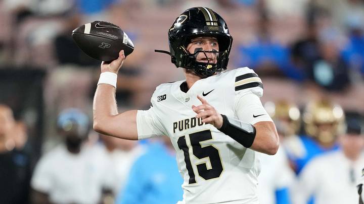 Purdue Boilermakers quarterback Ryan Browne (15) throws a 75-yard touchdown pass. Purdue Boilermakers quarterback Ryan Browne (15) throws a 75-yard touchdown pass.