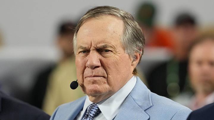 Jan 19, 2026; Miami Gardens, FL, USA; TV analyst Bill Belichick watches the Miami Hurricanes play the Indiana Hoosiers during the first half of the College Football Playoff National Championship game at Hard Rock Stadium. Mandatory Credit: Kirby Lee-Imagn Images
