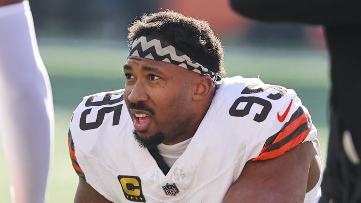 Jan 4, 2026; Cincinnati, Ohio, USA; Cleveland Browns defensive end Myles Garrett (95) kneels on the field during a first half timeout against the Cincinnati Bengals at Paycor Stadium.